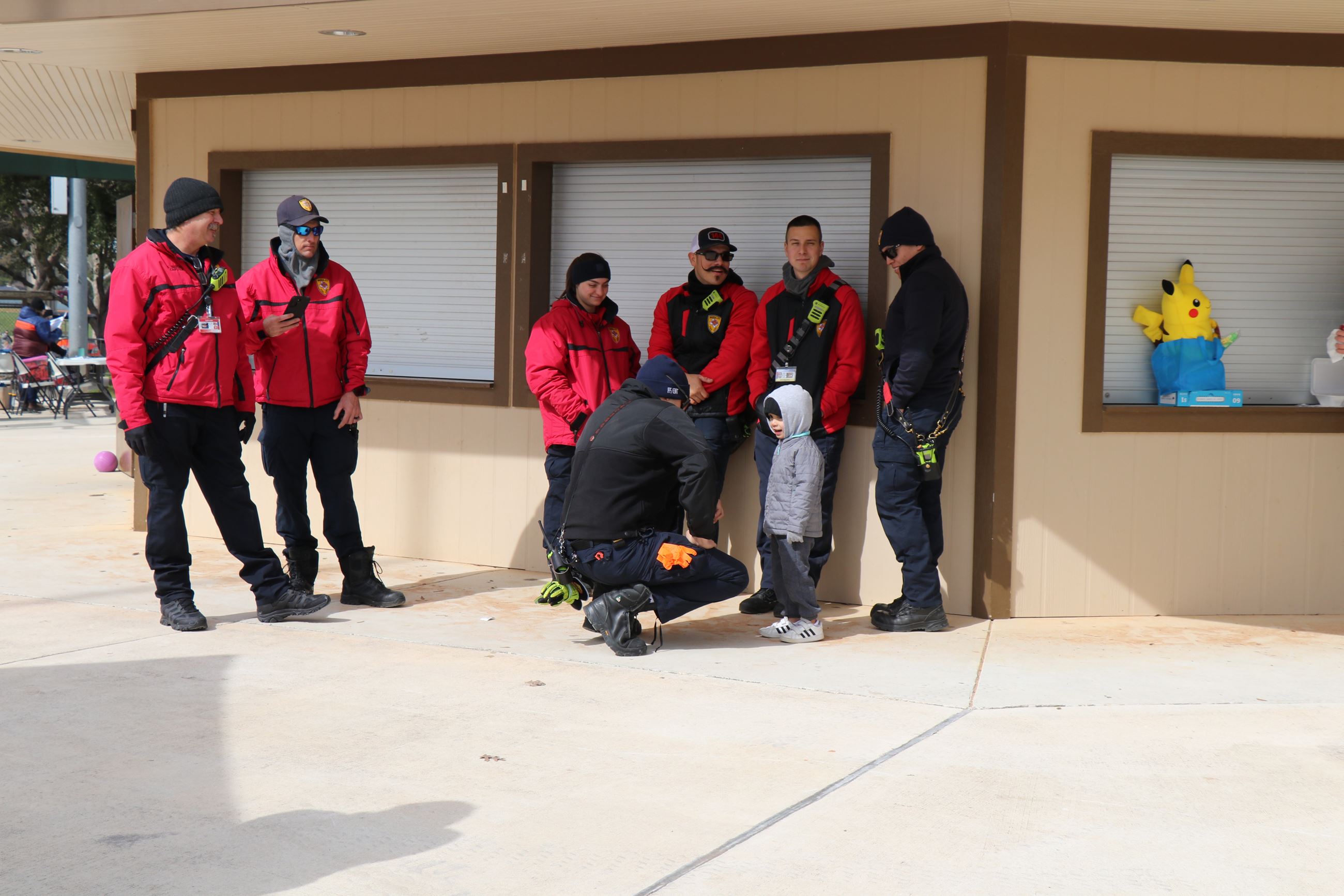 Fireman Speaking with Kid at Snowfest